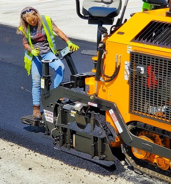 Asphalt Business-Woman driving asphalt machine