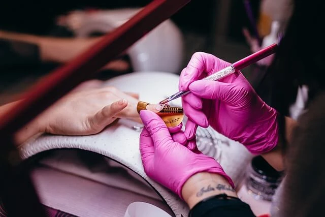 Beauty Salon-woman painting another woman's nails