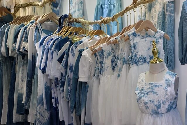 Clothing Boutique - blue and white tops on hangars