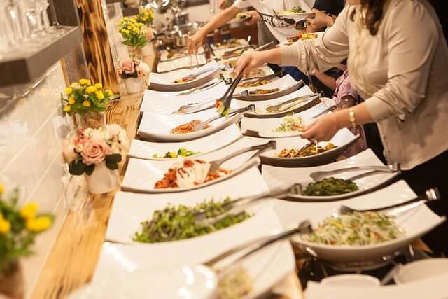 Event Planning-catered meal with people serving themselves