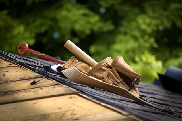 Roofing Business-roofer's tool belt on roof